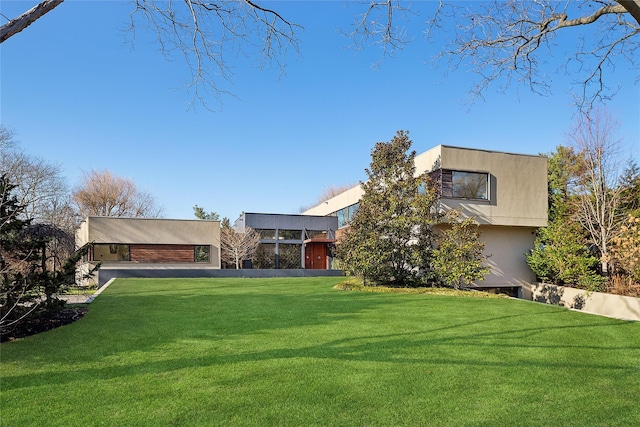 contemporary house with a front lawn