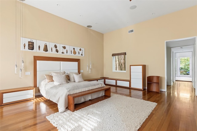 bedroom with hardwood / wood-style floors