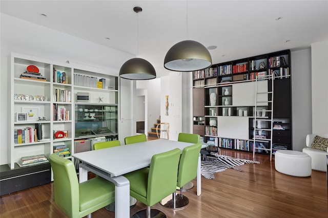 dining area with hardwood / wood-style flooring