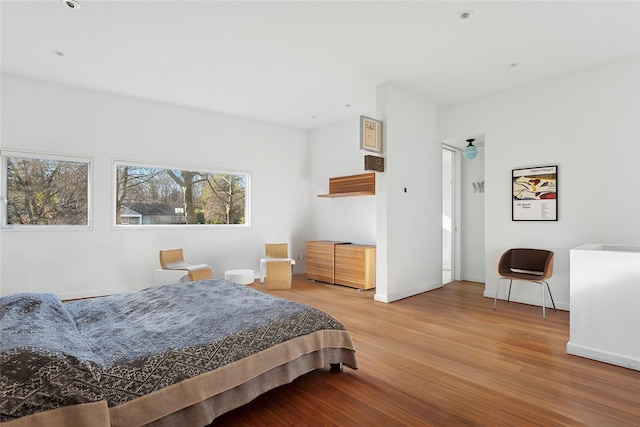 bedroom with hardwood / wood-style floors