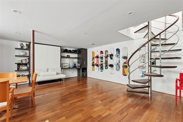 living area with hardwood / wood-style flooring