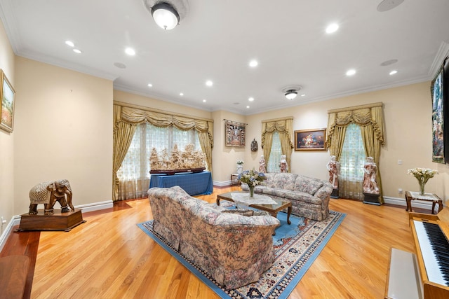 living room with light hardwood / wood-style floors and ornamental molding