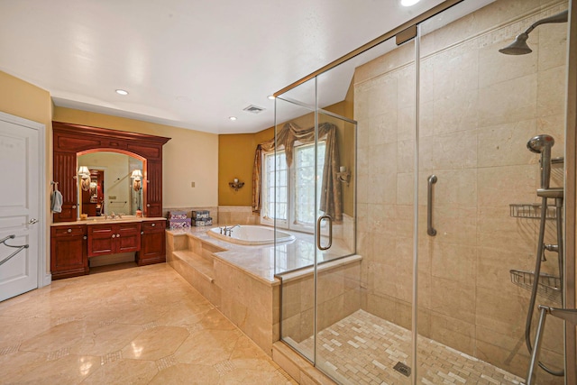 bathroom featuring vanity and plus walk in shower