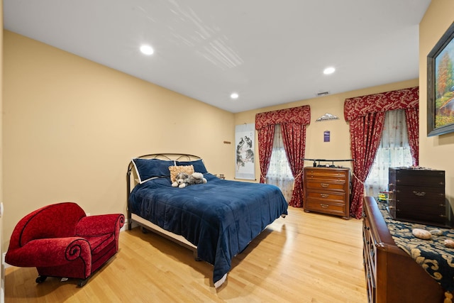 bedroom with wood-type flooring