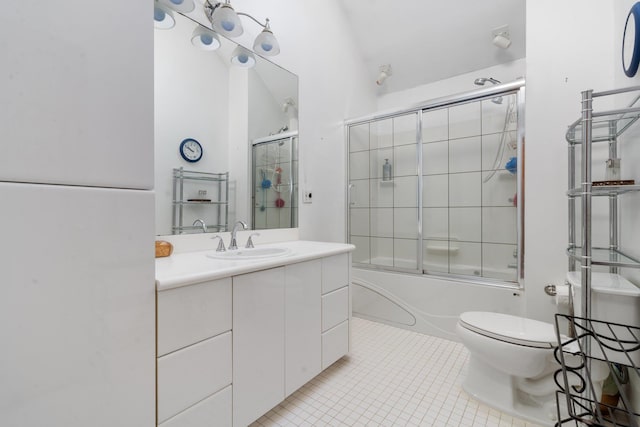 full bathroom with tile patterned floors, lofted ceiling, toilet, shower / bath combination with glass door, and vanity