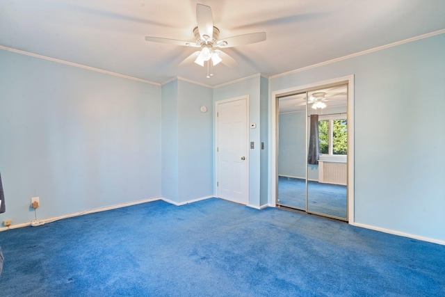 spare room featuring carpet, ceiling fan, and crown molding