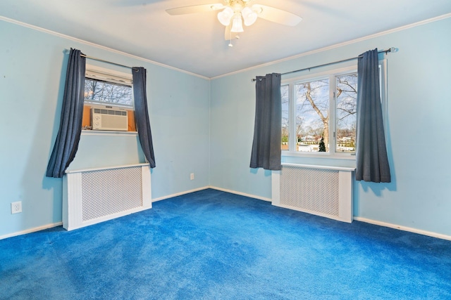 unfurnished room featuring dark colored carpet, radiator heating unit, a wealth of natural light, and ceiling fan