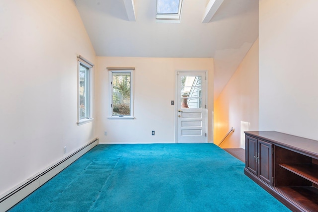 unfurnished room featuring lofted ceiling with skylight, carpet, and a baseboard radiator