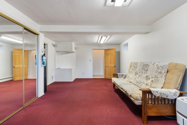 sitting room with baseboard heating and carpet