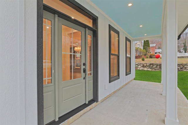 view of exterior entry with covered porch