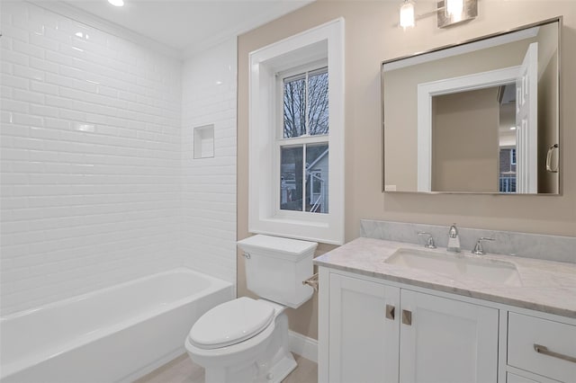 full bathroom with vanity, toilet, and tiled shower / bath