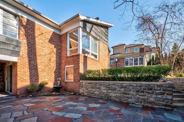 view of home's exterior with a patio area