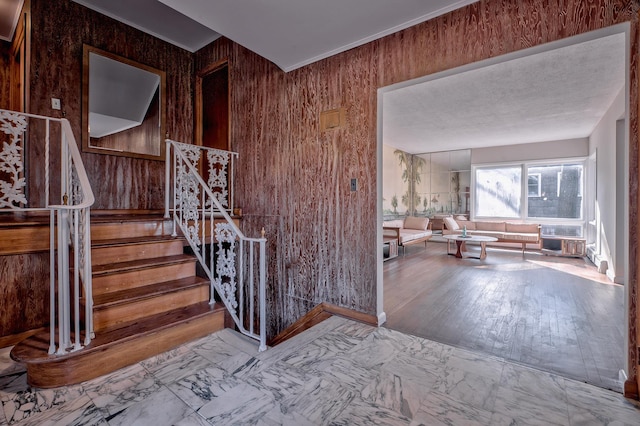 staircase with wooden walls