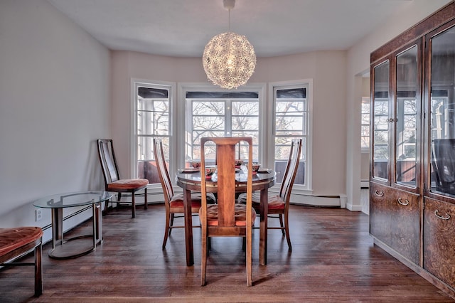 dining space with dark wood-type flooring and a chandelier