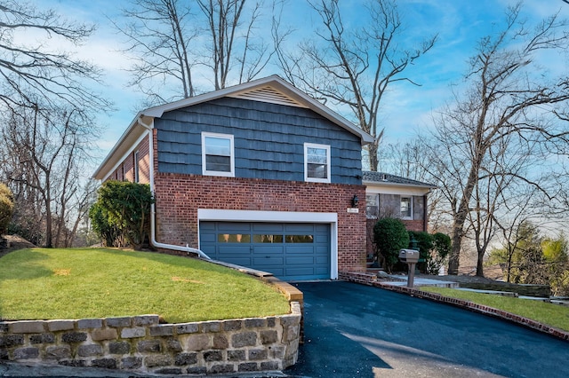 split level home with a front yard and a garage