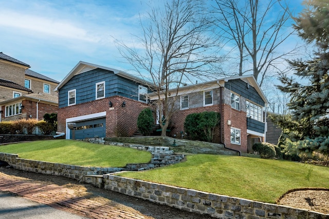 view of front of house featuring a garage and a front yard