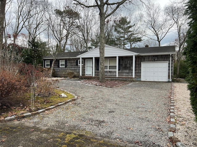 single story home featuring a garage