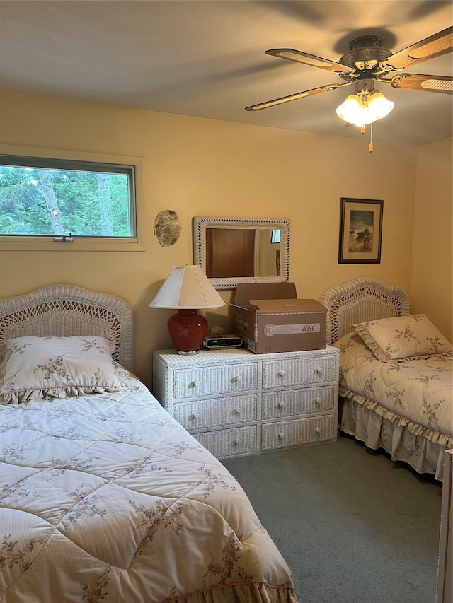 bedroom with ceiling fan and carpet