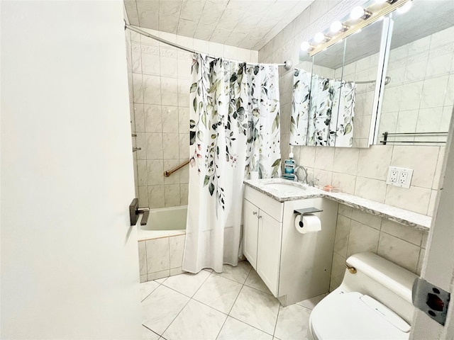 full bathroom featuring shower / bath combination with curtain, vanity, tile walls, tile patterned flooring, and toilet