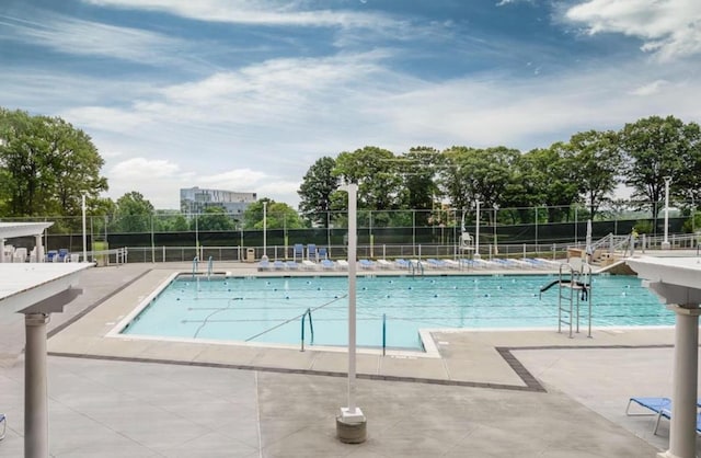 view of swimming pool featuring a patio area