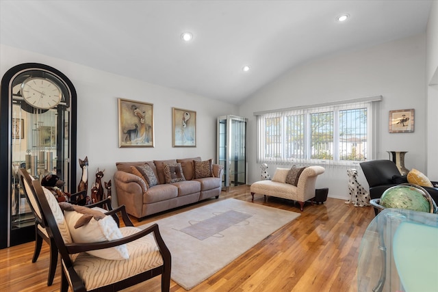 living room with lofted ceiling and light wood-type flooring