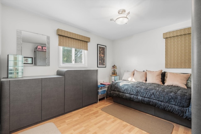 bedroom with light hardwood / wood-style flooring