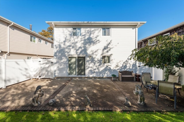 back of property featuring a patio