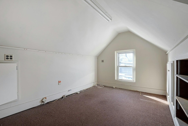 bonus room with carpet floors and lofted ceiling