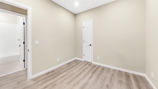 unfurnished room featuring light wood-type flooring