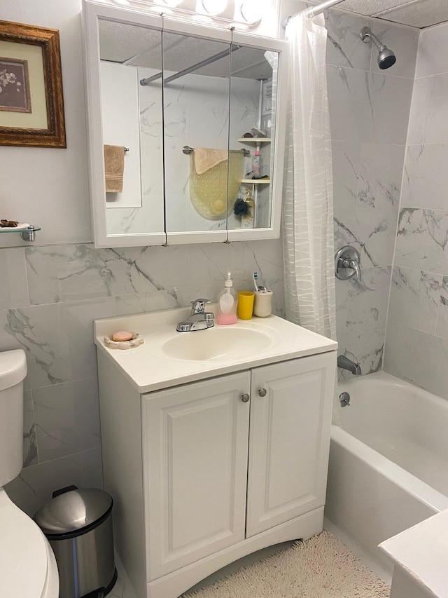 full bathroom with shower / bath combination with curtain, backsplash, vanity, tile walls, and toilet