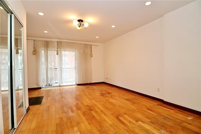 unfurnished room featuring light hardwood / wood-style flooring