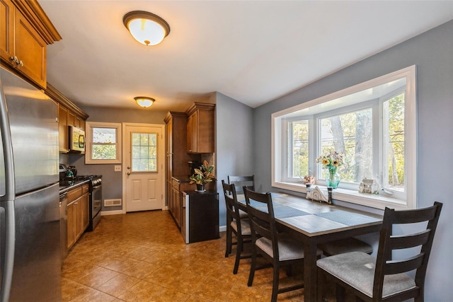 dining space featuring tile patterned floors