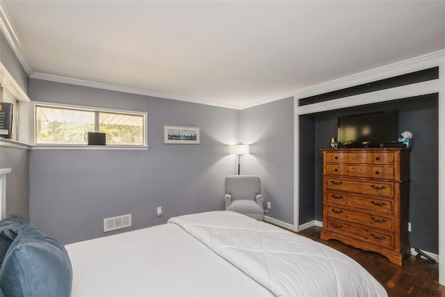 bedroom with crown molding and dark wood-type flooring