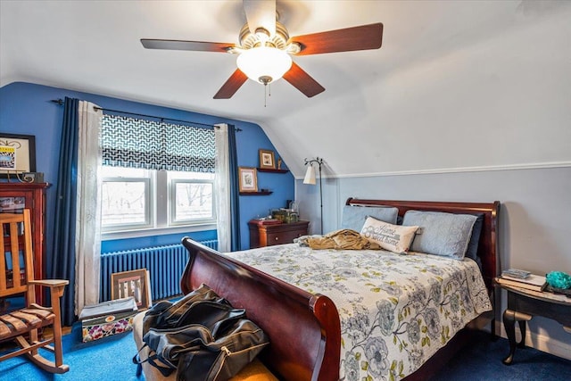 carpeted bedroom with radiator heating unit, vaulted ceiling, and ceiling fan