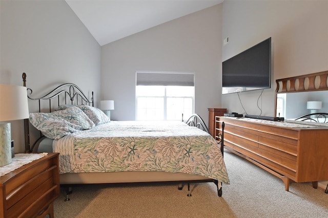 carpeted bedroom featuring high vaulted ceiling