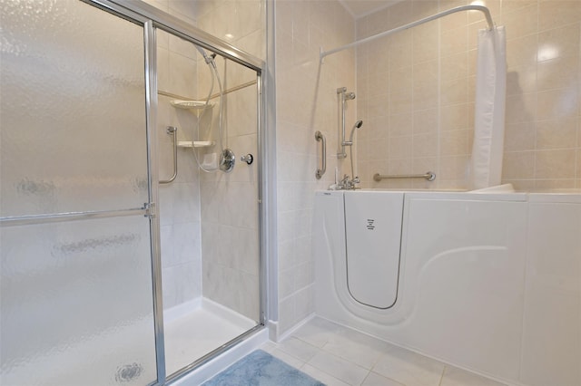 bathroom featuring tile patterned flooring and walk in shower