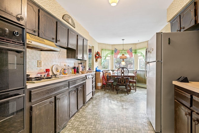 kitchen featuring pendant lighting, white appliances, sink, range hood, and dark brown cabinetry