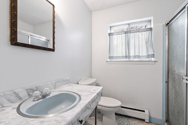 bathroom featuring a shower with door, sink, a baseboard radiator, and toilet