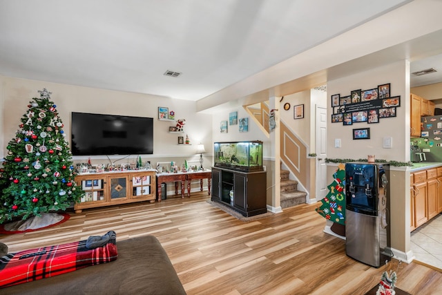 living room with light hardwood / wood-style flooring