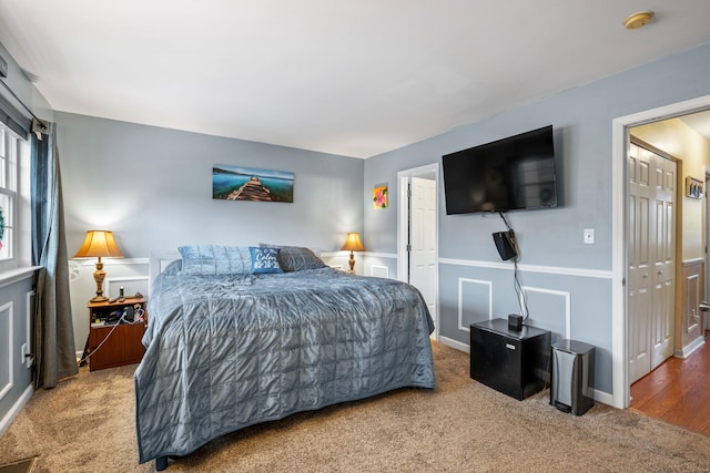 carpeted bedroom with a closet