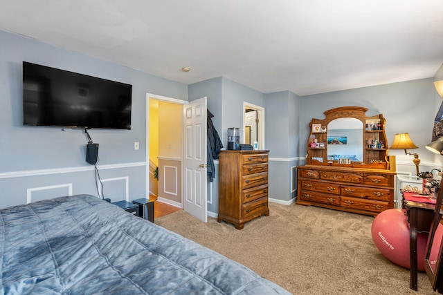 bedroom featuring light colored carpet