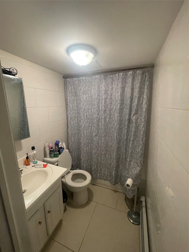 bathroom featuring toilet, vanity, and tile patterned flooring