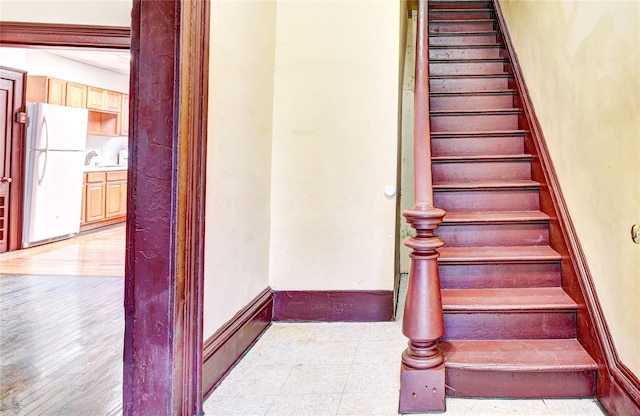 stairs with wood-type flooring