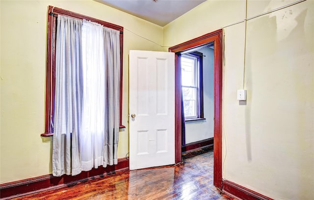 unfurnished room featuring hardwood / wood-style floors