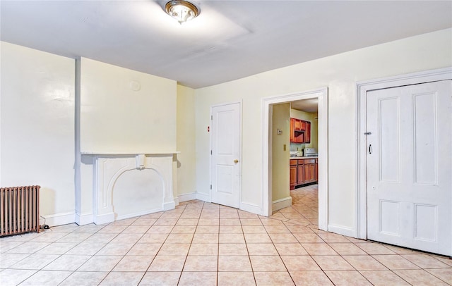 tiled spare room with radiator