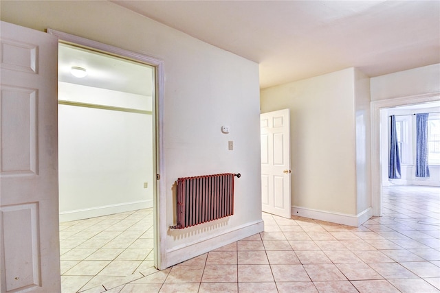 spare room featuring light tile patterned floors