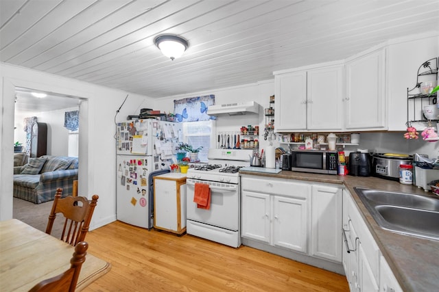 kitchen featuring white cabinets, exhaust hood, white appliances, and light wood-type flooring