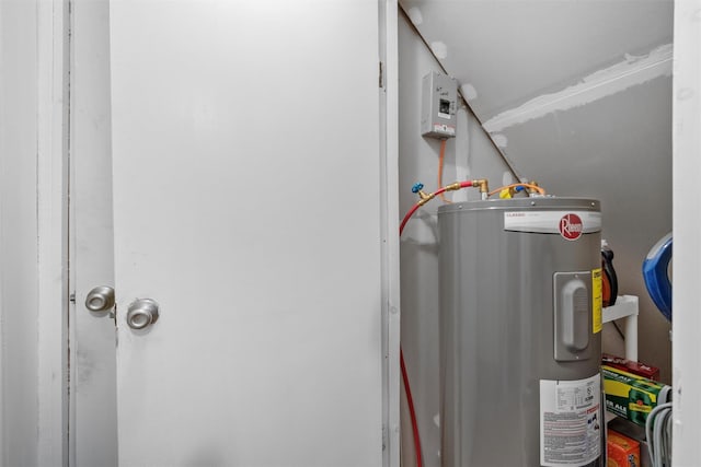 utility room featuring water heater