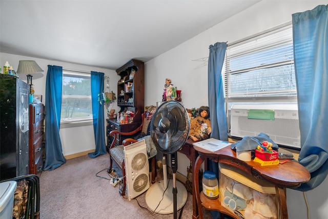 interior space featuring cooling unit, light carpet, and a wealth of natural light