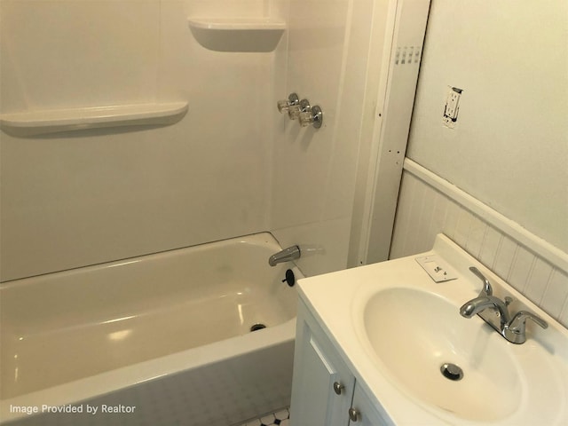 bathroom featuring plus walk in shower and sink